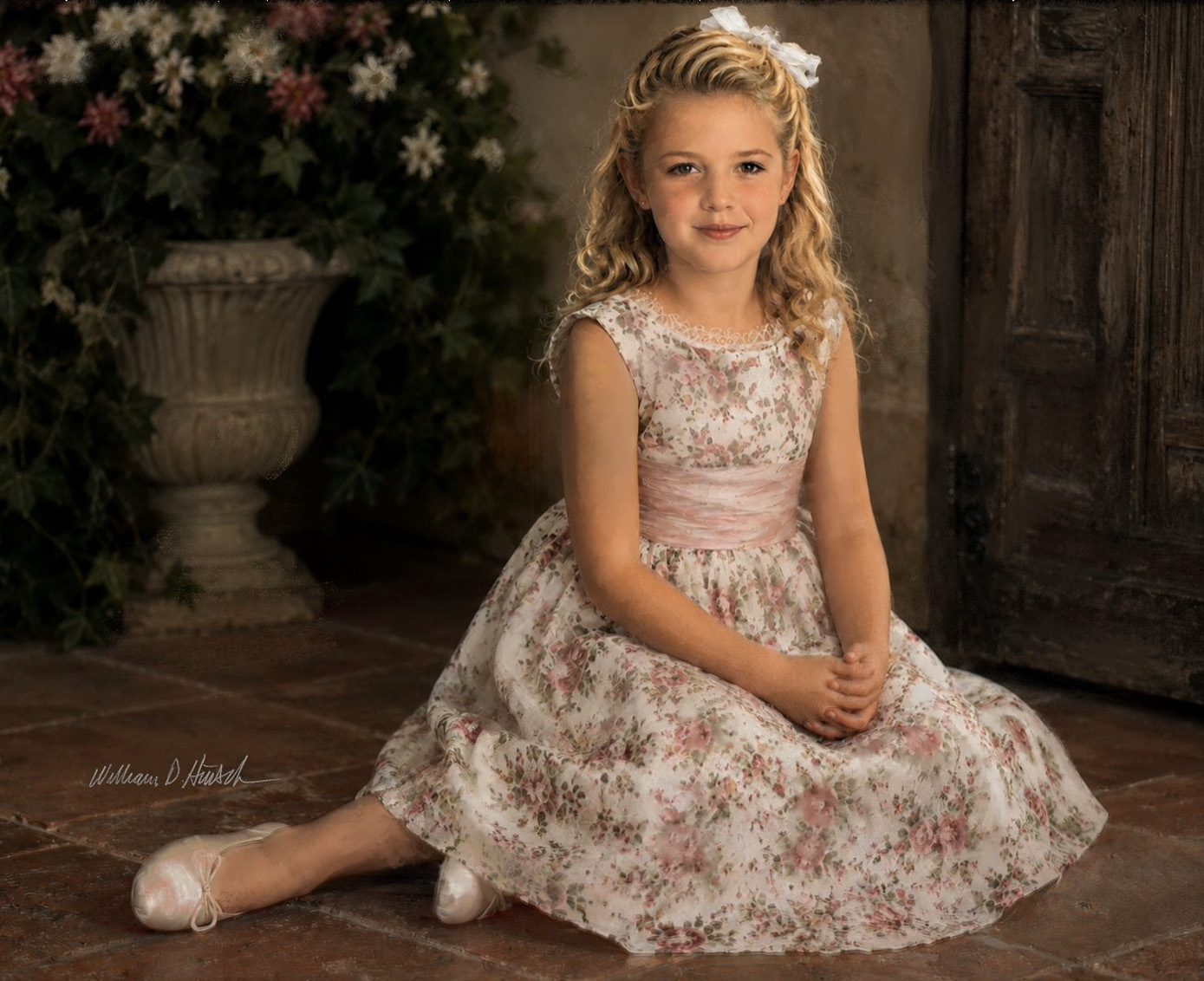 Portrait of a young girl in a floral dress.
