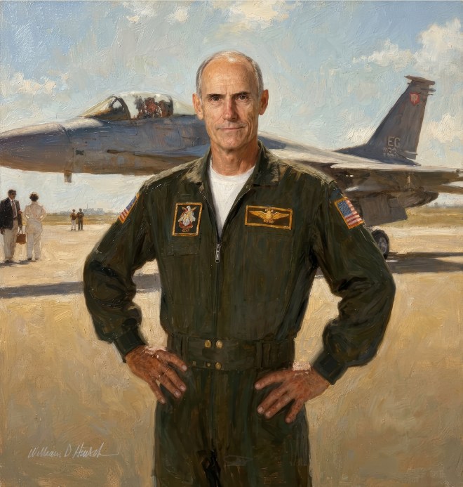 Portrait of a fighter pilot standing by a jet