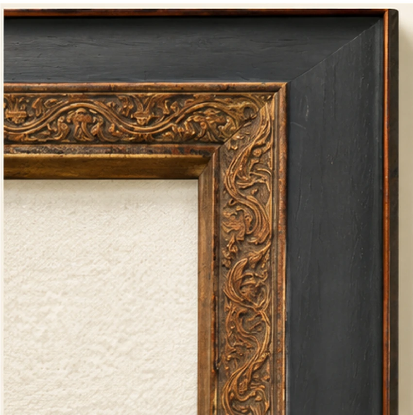 Black portrait frame with carved warm-gold inner leaf.