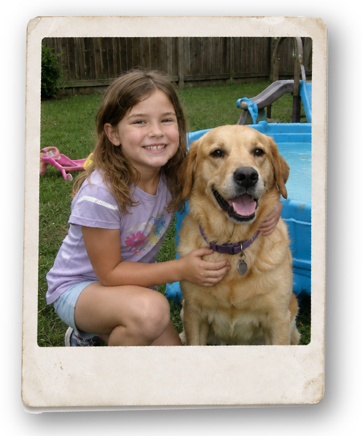 Casual backyard snapshot of a young girl sitting beside a golden retriever, shown as an imperfect source photograph.